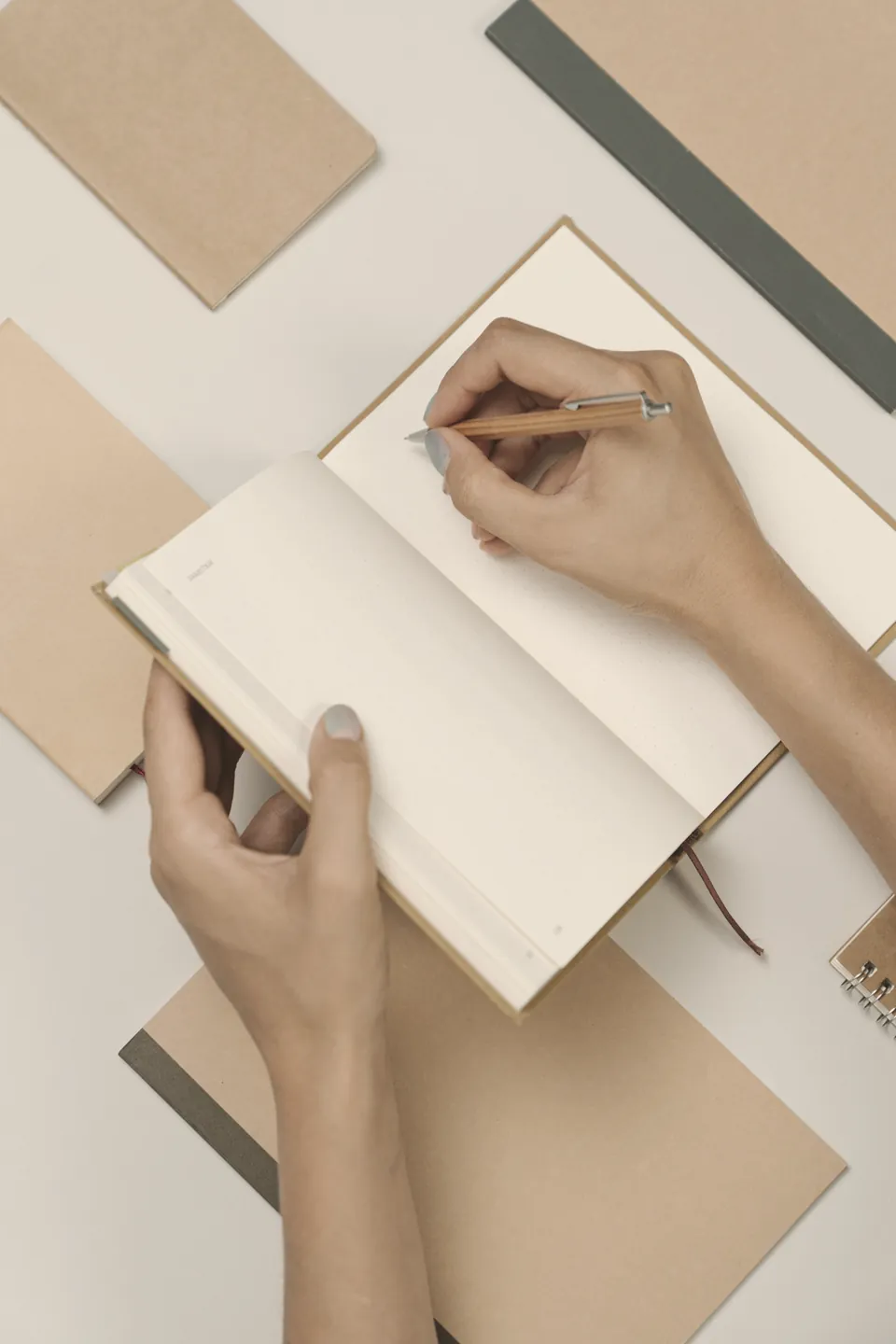 Writing by hand in a paper notebook